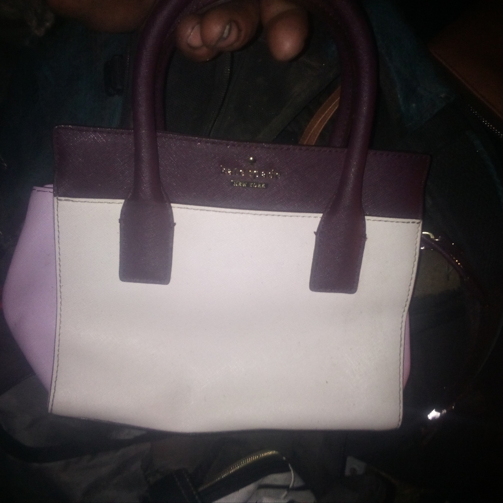 There's two Kate Spade purses and one Kate Spade makeup bag